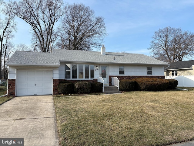 ranch-style home with a garage and a front lawn