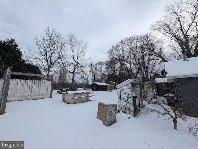 view of yard layered in snow