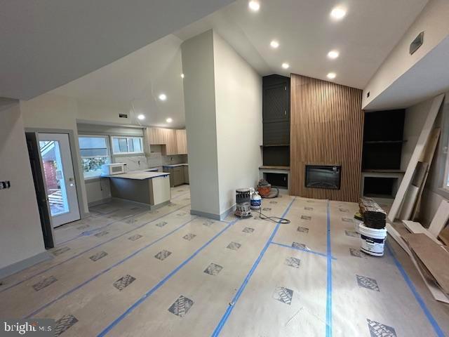 living room featuring a fireplace