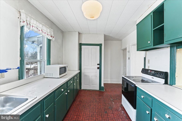 kitchen featuring white appliances and green cabinetry