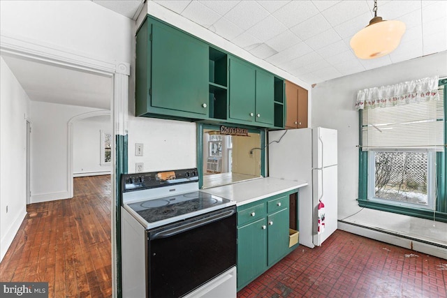 kitchen with green cabinets, white appliances, and a baseboard heating unit