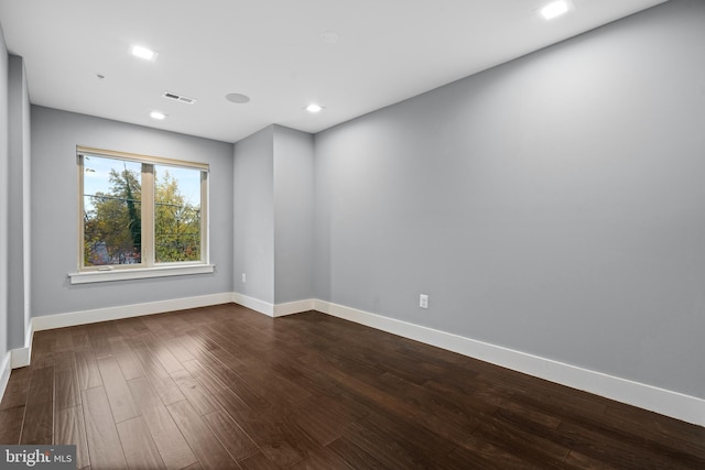 spare room featuring hardwood / wood-style flooring