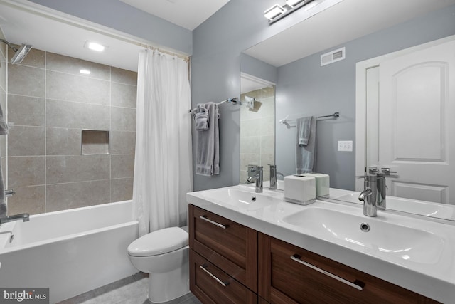 full bathroom with vanity, toilet, and shower / bath combo with shower curtain