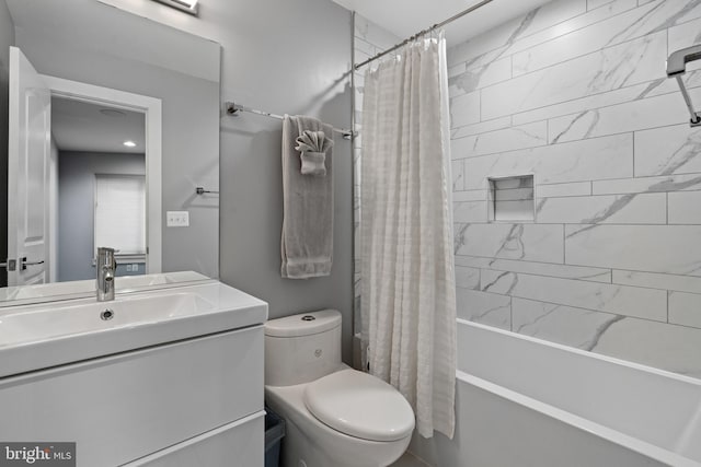 full bathroom featuring vanity, toilet, and shower / tub combo