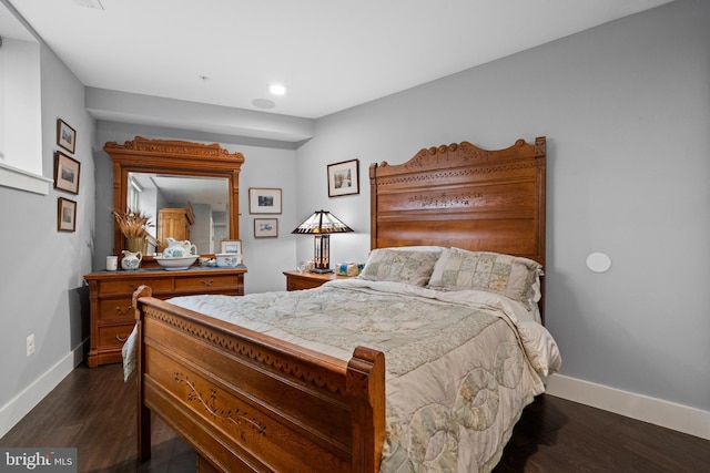 bedroom featuring dark wood-type flooring