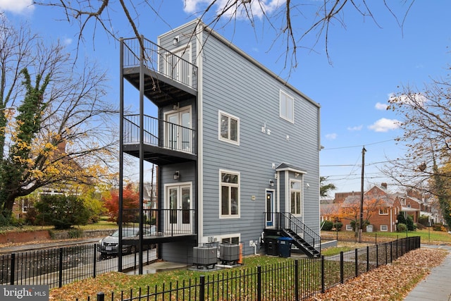 exterior space featuring a balcony and cooling unit