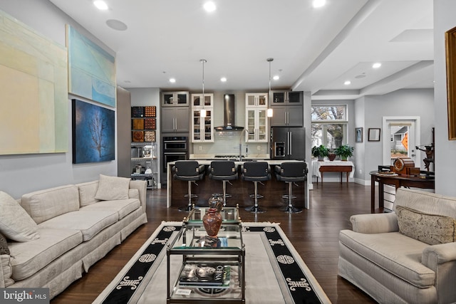 living room with dark hardwood / wood-style flooring