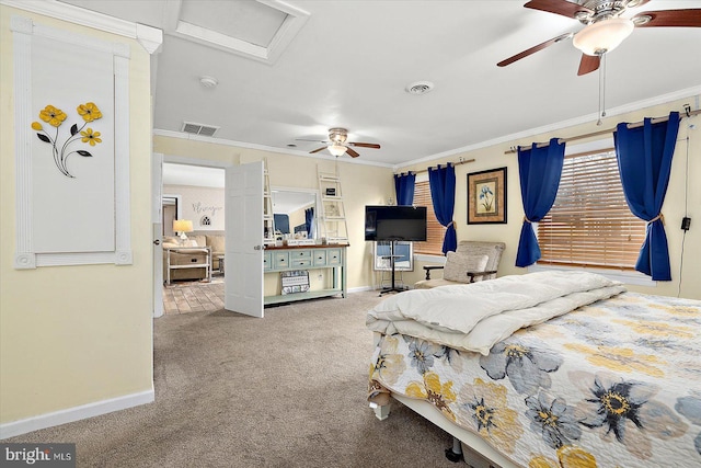 carpeted bedroom featuring ceiling fan and crown molding