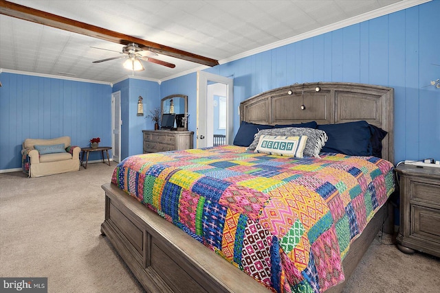 carpeted bedroom with ceiling fan and ornamental molding