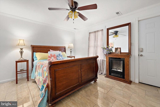 bedroom with ceiling fan and ornamental molding