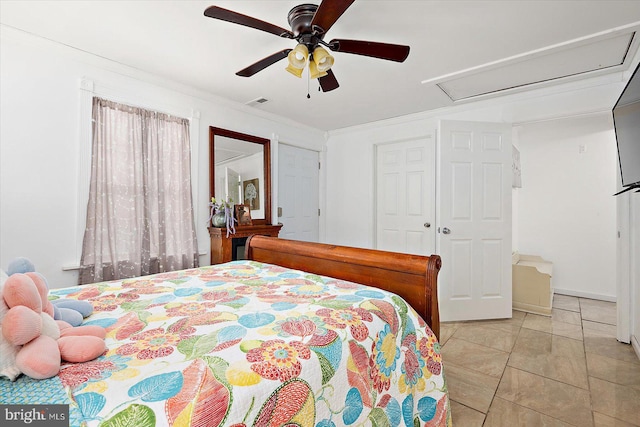 bedroom featuring ceiling fan, light tile patterned floors, and crown molding