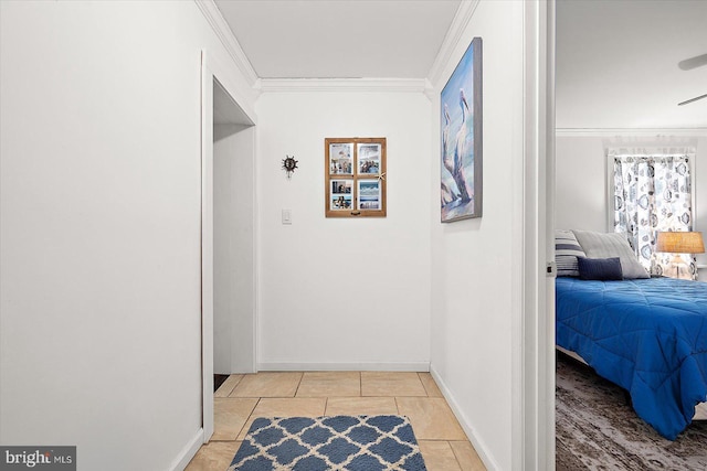 corridor featuring light tile patterned floors and ornamental molding