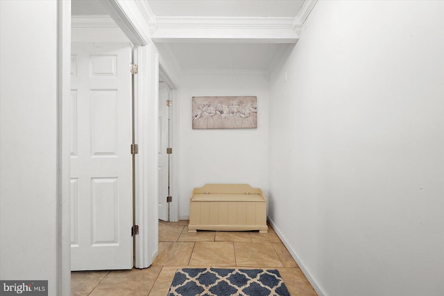 corridor featuring light tile patterned floors and ornamental molding