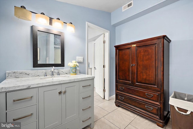 bathroom with tile patterned flooring and vanity