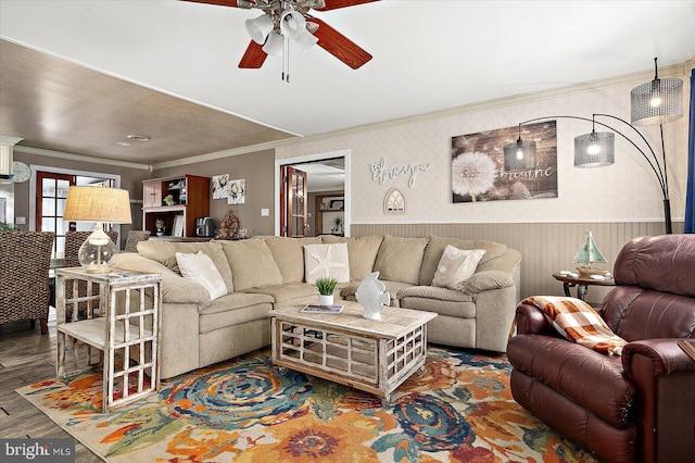 living room with ceiling fan, crown molding, and parquet floors