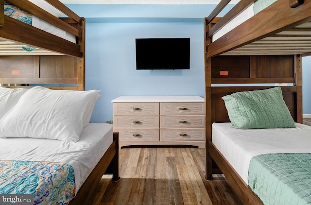 bedroom featuring dark hardwood / wood-style flooring