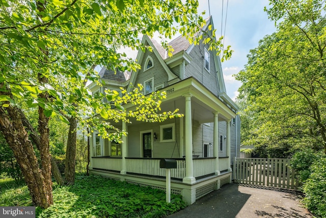 view of property exterior featuring a porch