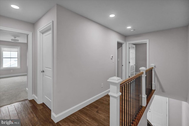 corridor with dark wood-type flooring