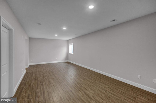 unfurnished room with hardwood / wood-style floors