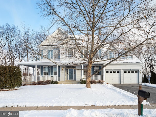 view of front of home featuring covered porch and a garage