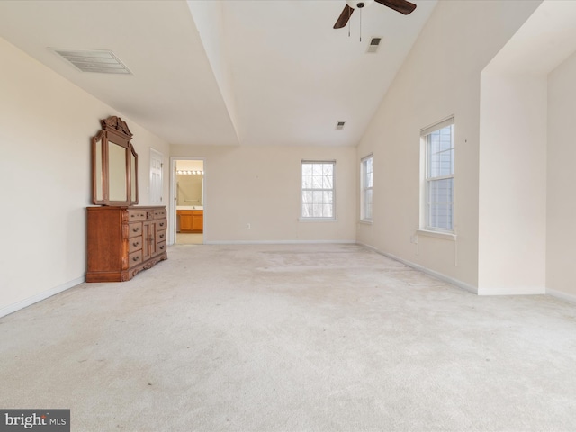 unfurnished living room featuring light carpet, ceiling fan, and lofted ceiling