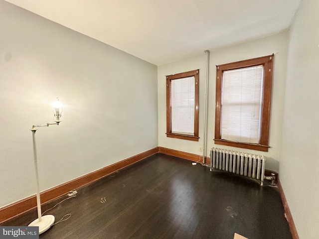 empty room featuring radiator heating unit