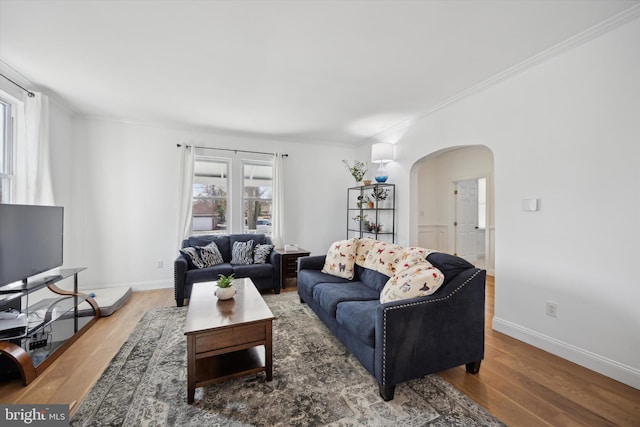 living room with hardwood / wood-style flooring and ornamental molding