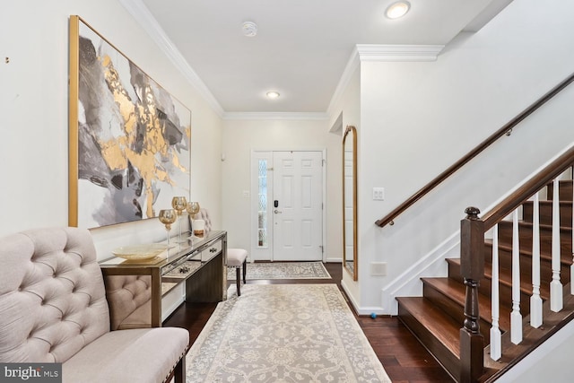 entryway with crown molding and dark wood-type flooring