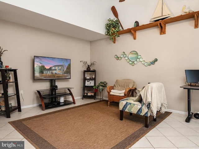 sitting room with light tile patterned floors