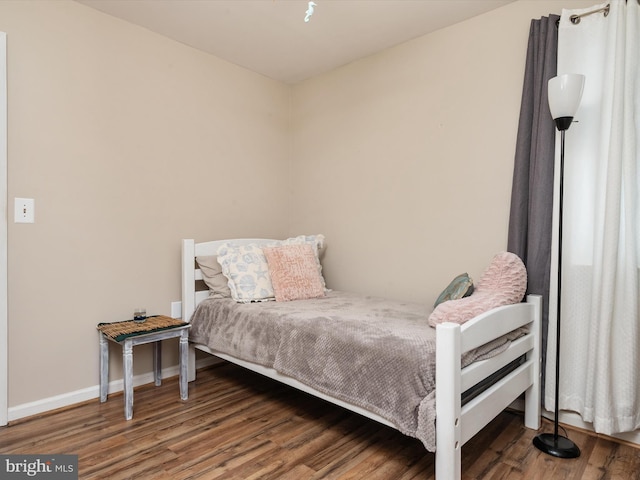 bedroom featuring wood-type flooring