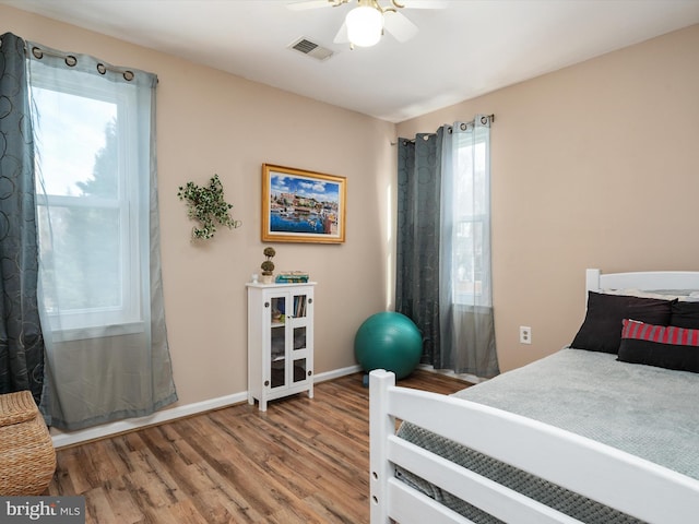 bedroom featuring wood-type flooring and ceiling fan