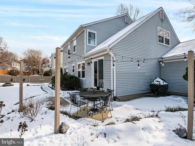 view of snow covered house