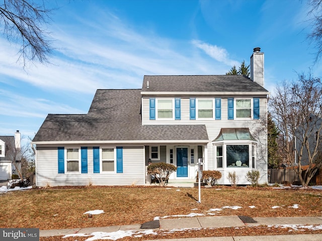 view of front of property with a front lawn