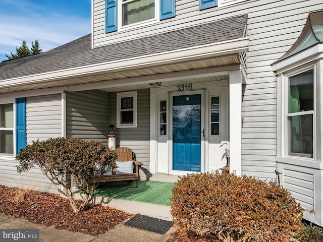 doorway to property featuring a porch