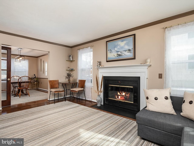 living room featuring hardwood / wood-style flooring and ornamental molding