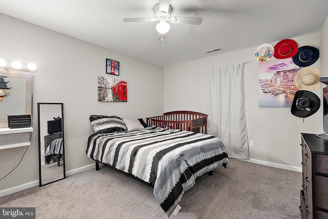 bedroom featuring ceiling fan and light colored carpet