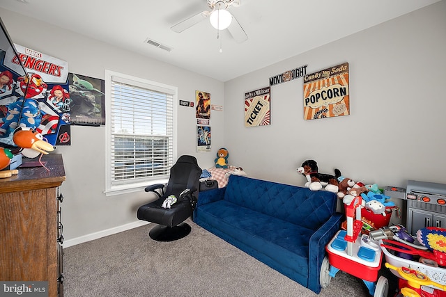 interior space with ceiling fan and carpet