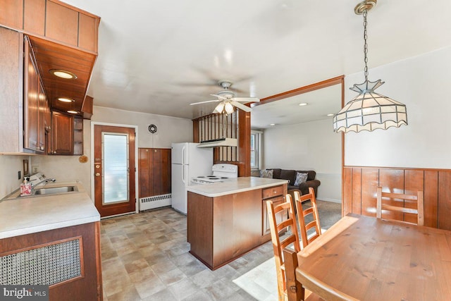 kitchen with ceiling fan, sink, baseboard heating, decorative light fixtures, and white appliances