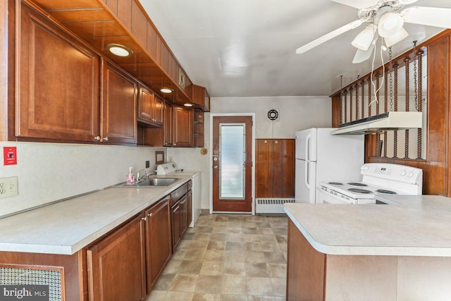 kitchen featuring white appliances, sink, ceiling fan, range hood, and kitchen peninsula