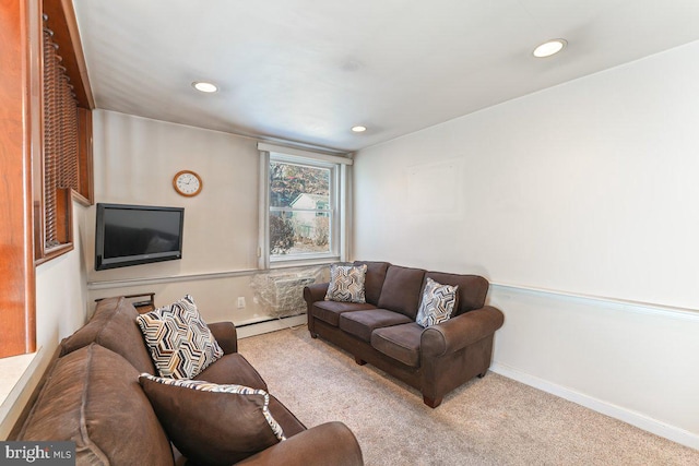 living room featuring light colored carpet and a baseboard heating unit