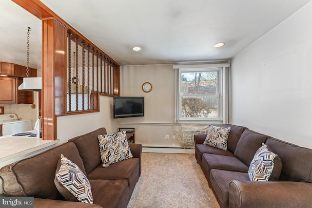 living room with light colored carpet and a baseboard radiator