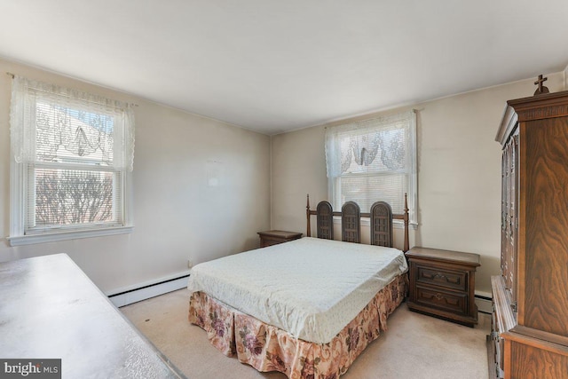 carpeted bedroom with a baseboard radiator