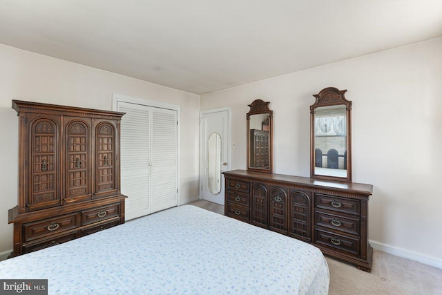 carpeted bedroom with a closet