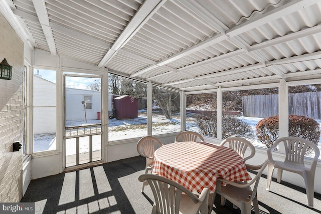 sunroom / solarium with vaulted ceiling