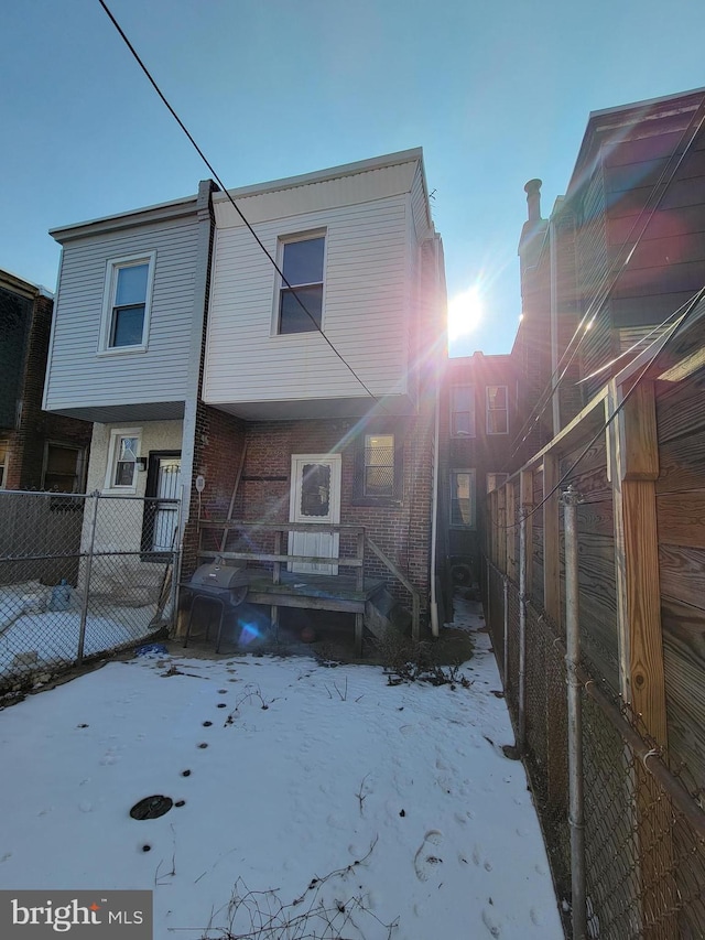 view of snow covered house