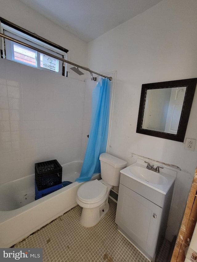 full bathroom with tile patterned floors, vanity, toilet, and shower / tub combo with curtain