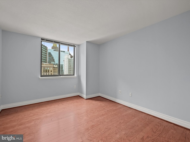 unfurnished room featuring light hardwood / wood-style flooring