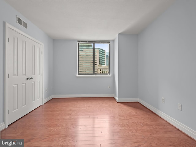 unfurnished bedroom featuring light hardwood / wood-style floors