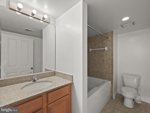 full bathroom featuring toilet, tile patterned flooring, vanity, and washtub / shower combination