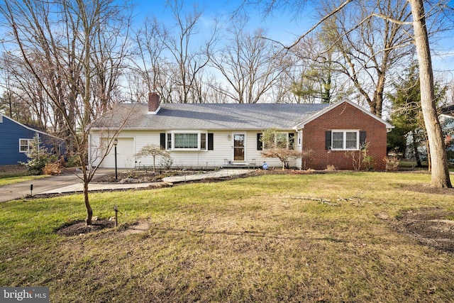 single story home with a garage and a front yard